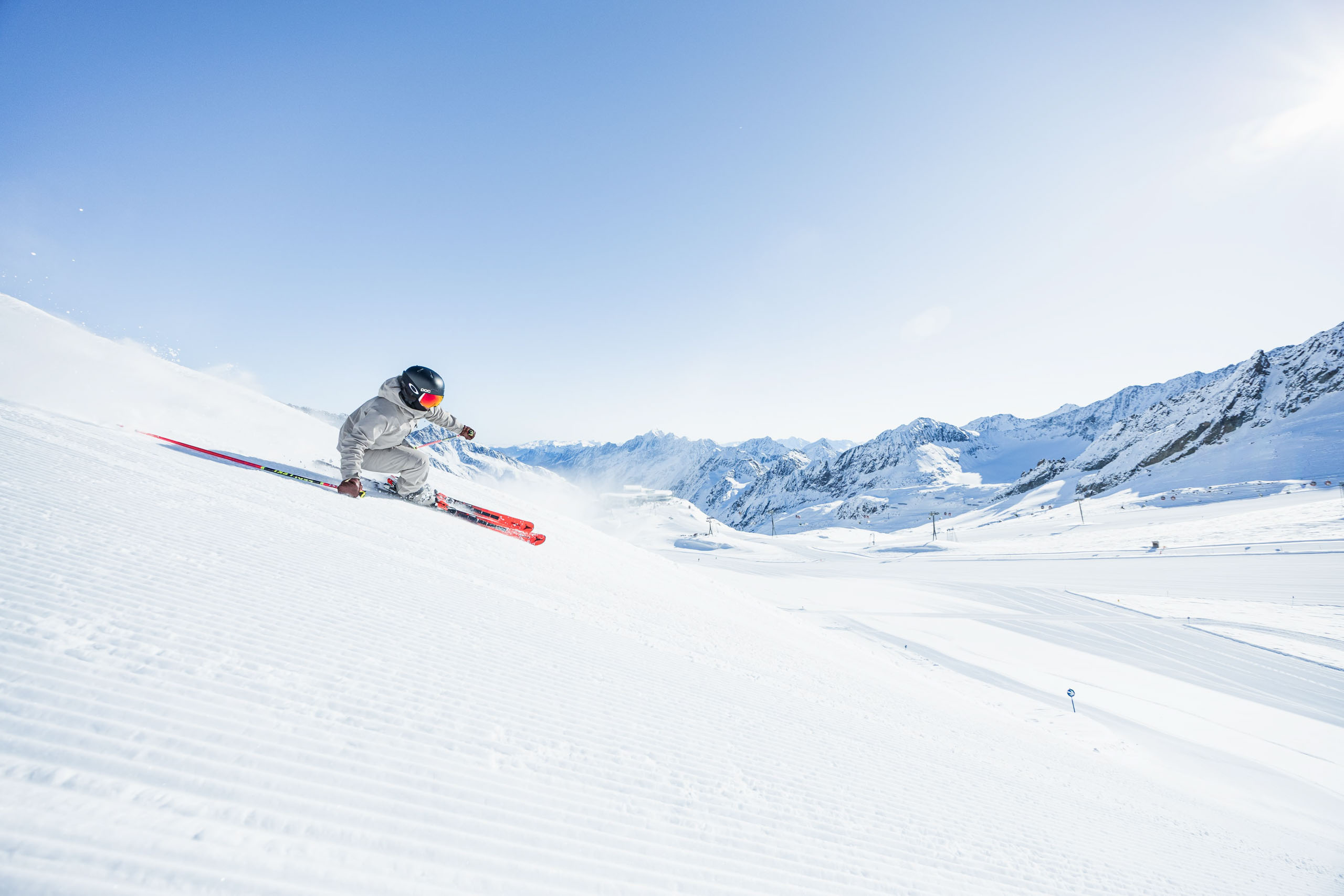 A female skier on the perfectly groomed piste on the Stubai Glacier