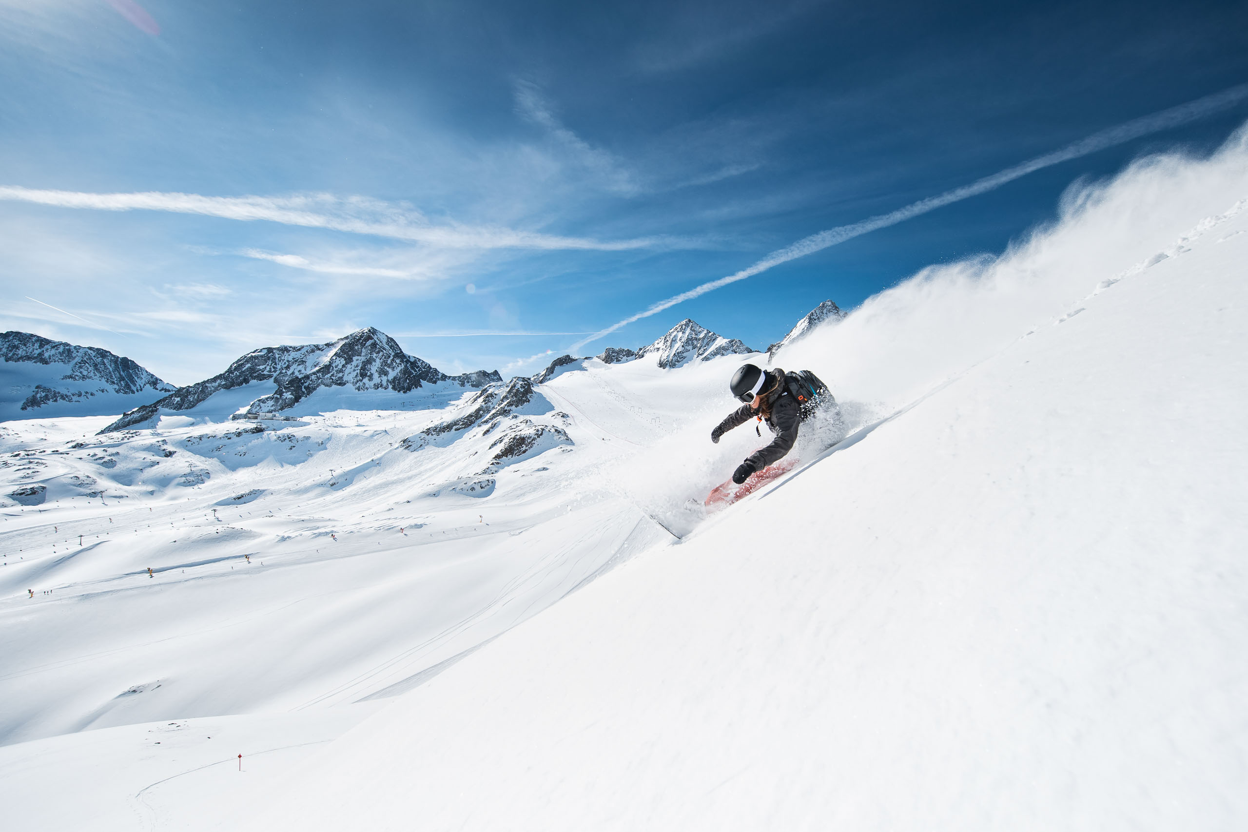 A female snowboarder freeriding on the Stubai Glacier
